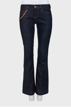 Flared jeans decorated with chain