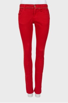 Red jeans with embellished waist
