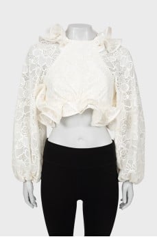 Lace blouse with voluminous sleeves