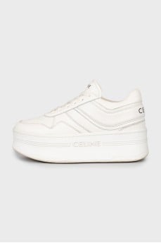 White high-heeled sneakers