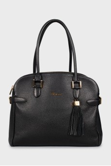Leather bag decorated with buckles