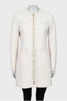 White jacket decorated with fringe