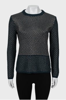 Knitted sweater decorated with weaving