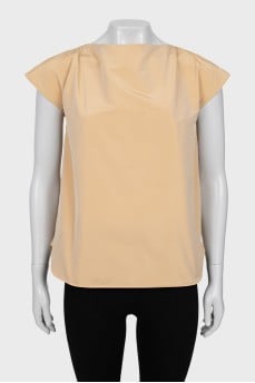 Beige blouse with ties on the back
