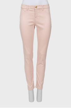 Light pink jeans with gold button