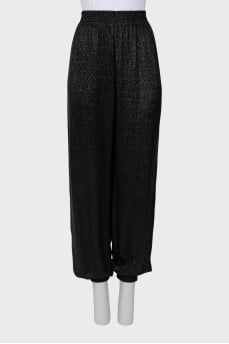 Elastic trousers with lurex