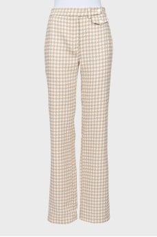 Trousers in houndstooth print with tag