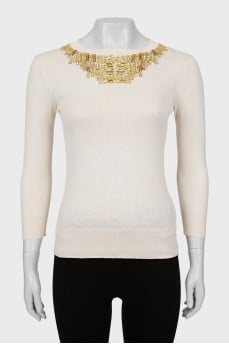 Beige jumper decorated with rhinestones