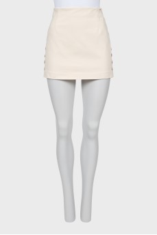 Mini skirt decorated with buttons