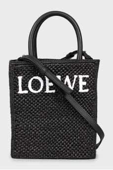 Woven crossbody bag with tag