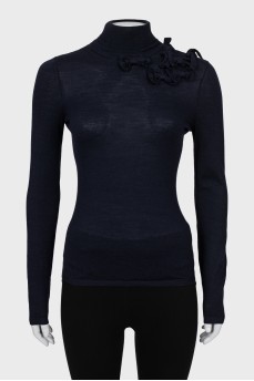 Knitted golf shirt decorated with bows