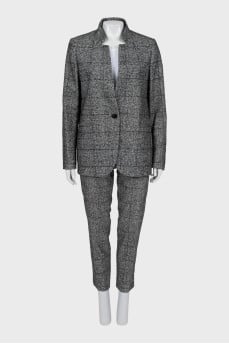 Suit with trousers in checkered print