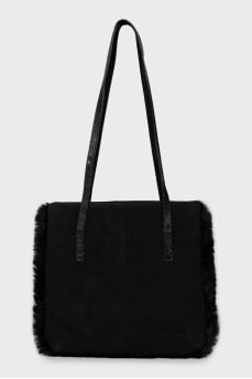 Suede bag decorated with fur