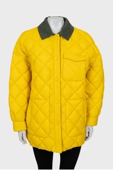 Reversible quilted jacket with tag
