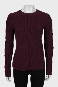 Knitted sweater with decor on the sleeves