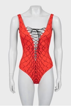 One-piece swimsuit with laces and tag