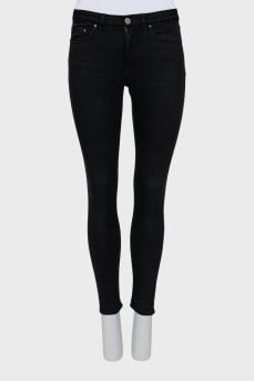 High-waisted black skinny jeans
