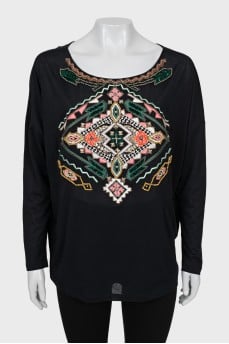 Blouse decorated with embroidery and beads