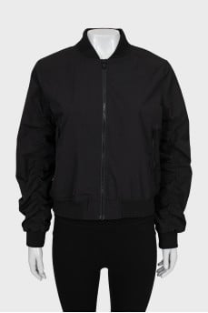 Bomber jacket with draped sleeves