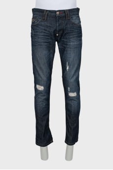 Men's blue jeans with distressed effect