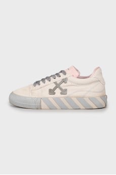 Textile sneakers decorated with a tag