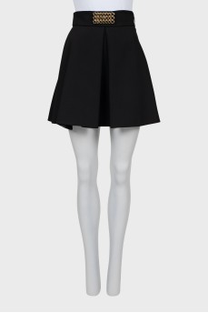 Mini skirt with golden decoration