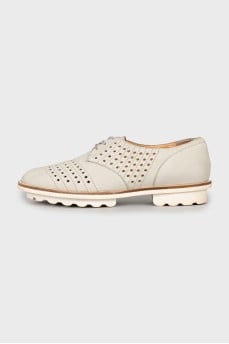 Perforated suede shoes