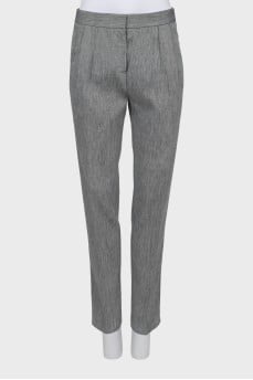 Trousers with arrows in fine print