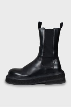 Black leather boots with chunky soles
