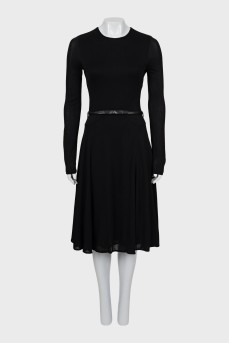 Fitted black dress with long sleeves