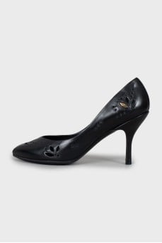 Black leather shoes with perforations