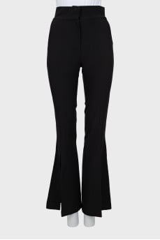 Flared trousers with slits at the bottom