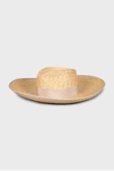 Straw hat decorated with a bow