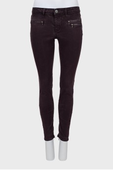 Purple jeans decorated with zippers