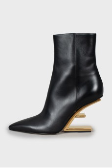 Leather ankle boots with gold heel