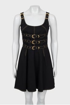 Dress decorated with buckles and tag