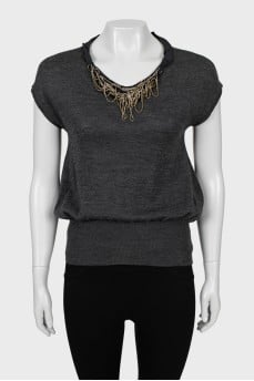 Knitted vest decorated with rhinestones