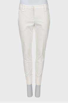 Cropped white trousers with arrows