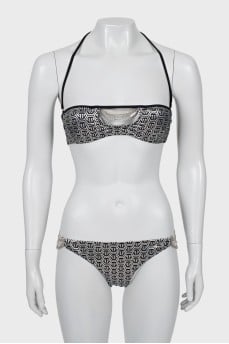 Swimsuit in branded print with tag