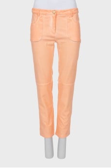 Orange trousers with patch pockets