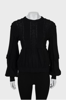 Black sweater decorated with macrame