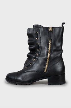Leather boots decorated with frills