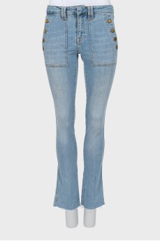 Flared jeans with gold buttons