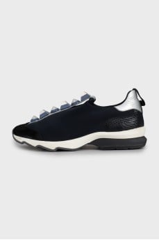 Textile sneakers decorated with spikes
