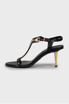 Leather sandals with golden stiletto heels