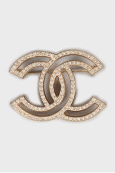 Golden brooch decorated with rhinestones