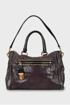 Leather tote bag with metal decor