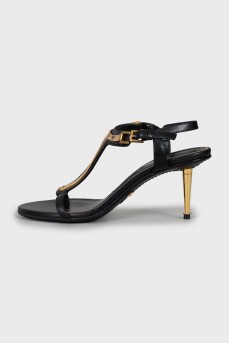 Leather sandals with golden heels