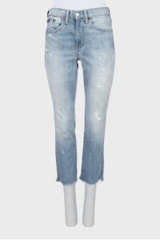 Light blue jeans with raw hem