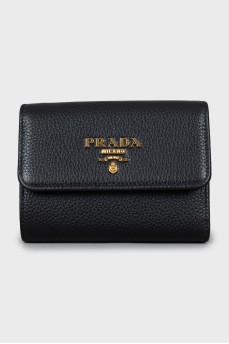Leather wallet with gold logo and tag